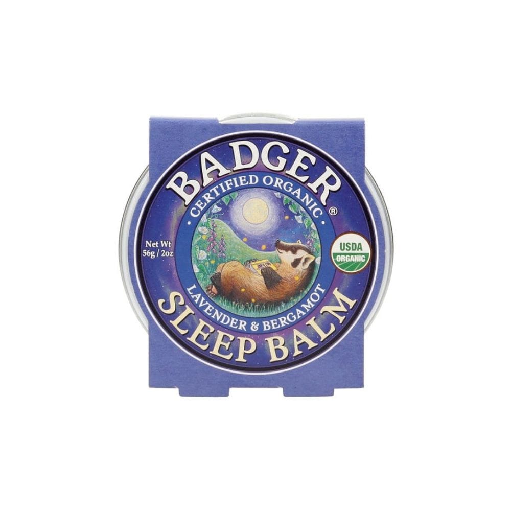 Badger Sleep Balm container with blue lid and label on a white background