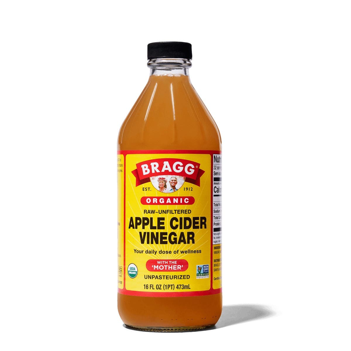 Bottle of Bragg Organic Apple Cider Vinegar on a white background