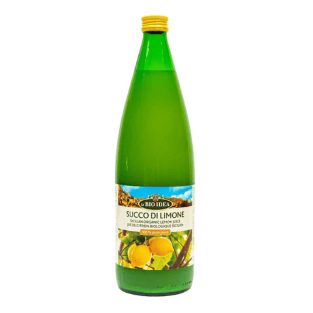 A green glass bottle of Bio Ida Succo Di Limone (organic lemon juice) with a yellow cap and a white label featuring orange lemons, set against a plain white background.