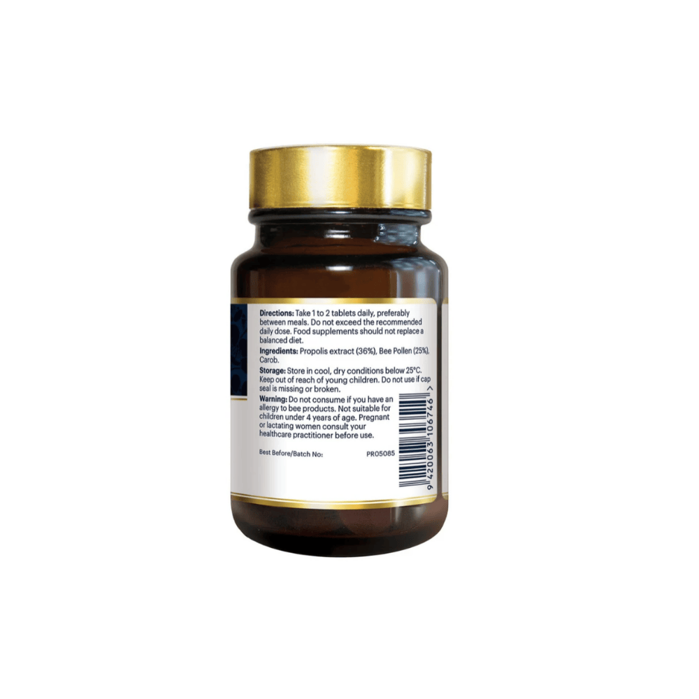 A dark amber glass supplement bottle with a metallic gold cap, showing the back label with text, barcode, and a small red logo, on a plain white background.