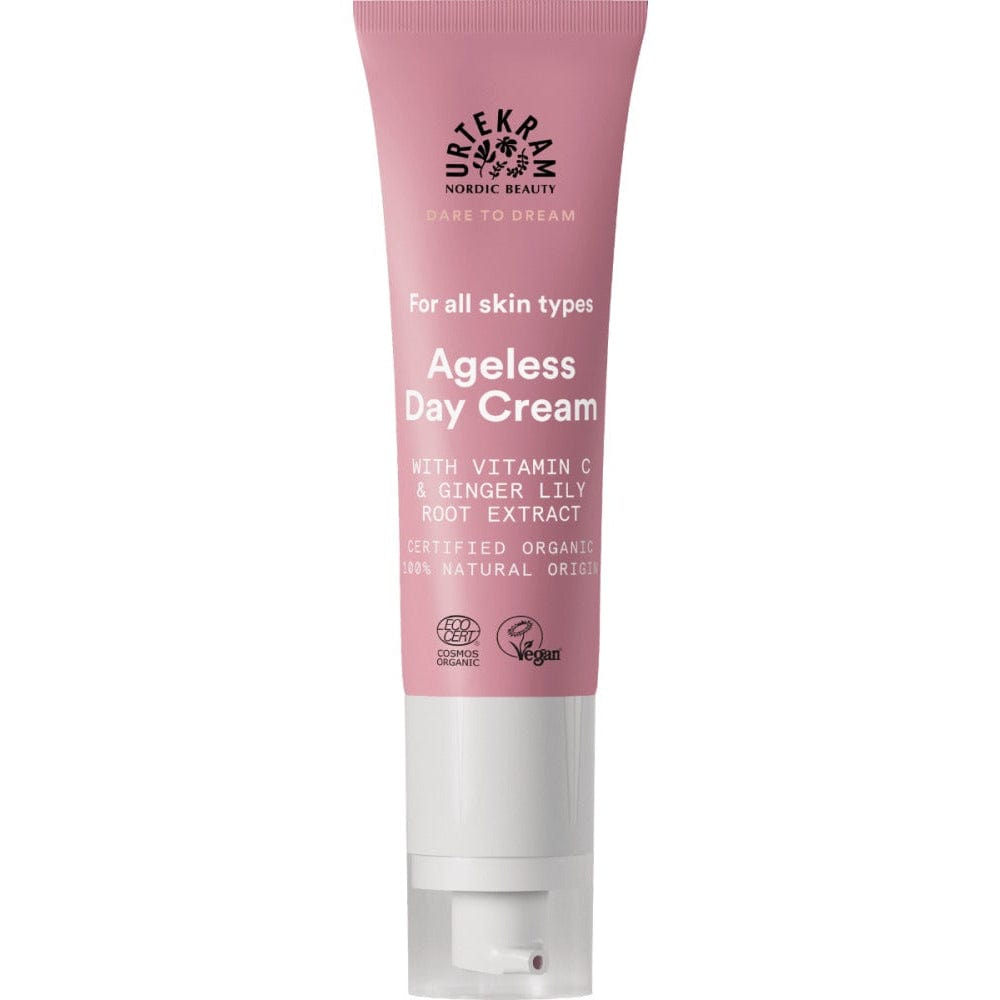 Pink tube of Ageless Day Cream on a white background