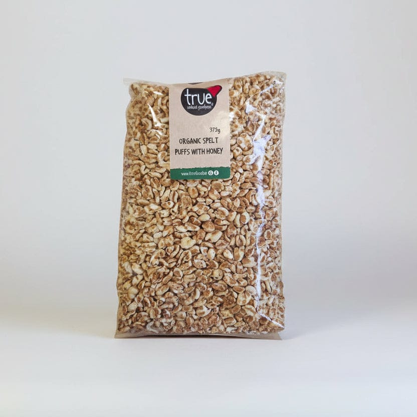 Bag of organic spelt puffs with honey by true food on a white background