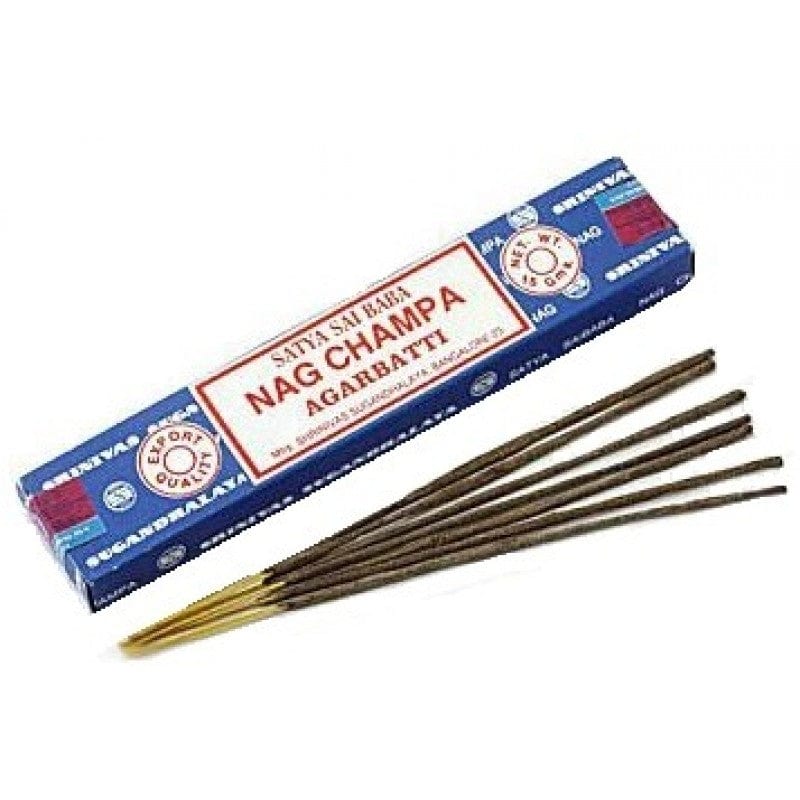 A box of Satya Nag Champa incense sticks displayed with several sticks partially out of the box showing the brown color and pointed ends.
