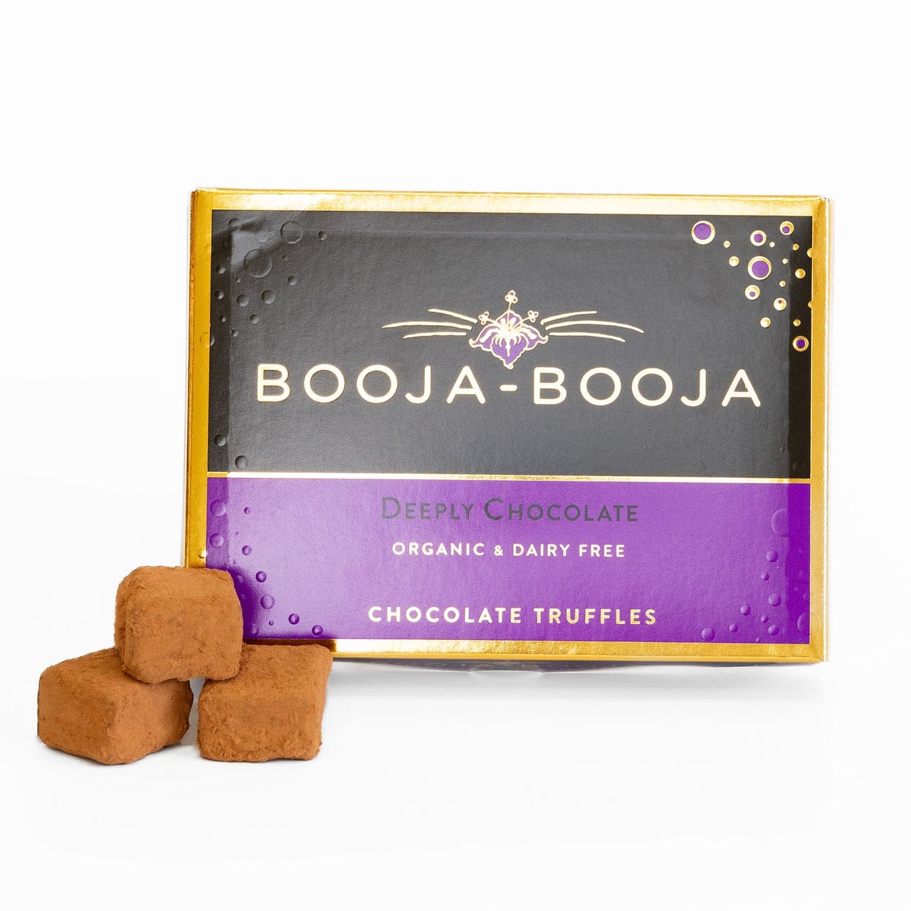 Box of Booja-Booja chocolate truffles with two truffles in front on a white background