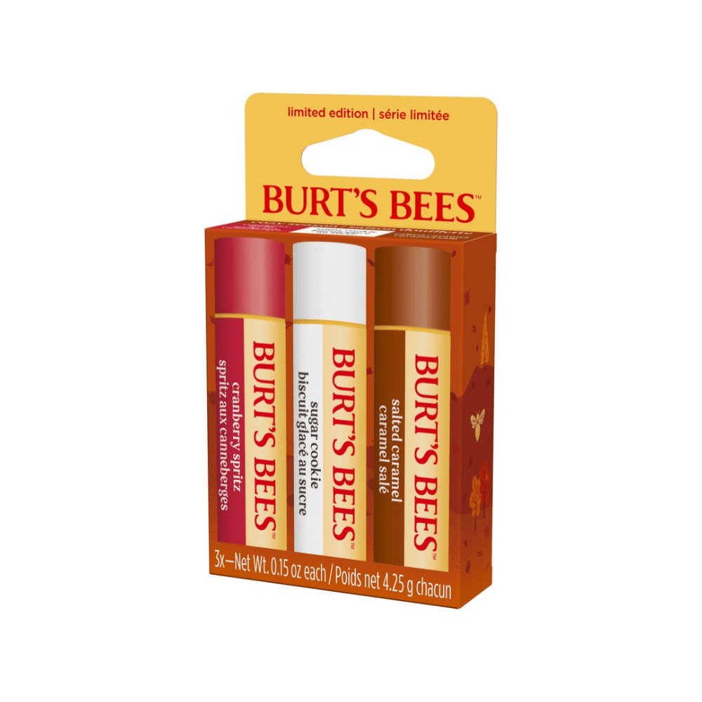 Burt's Bees lip balm set in its original cardboard packaging, featuring three tubes of balm in red, white, and brown shades.