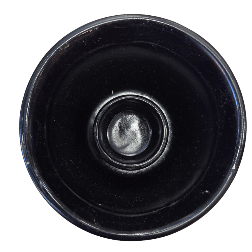 A close-up top-down view of a black circular plastic component, likely a lens protector or filter mount, on a solid white background.