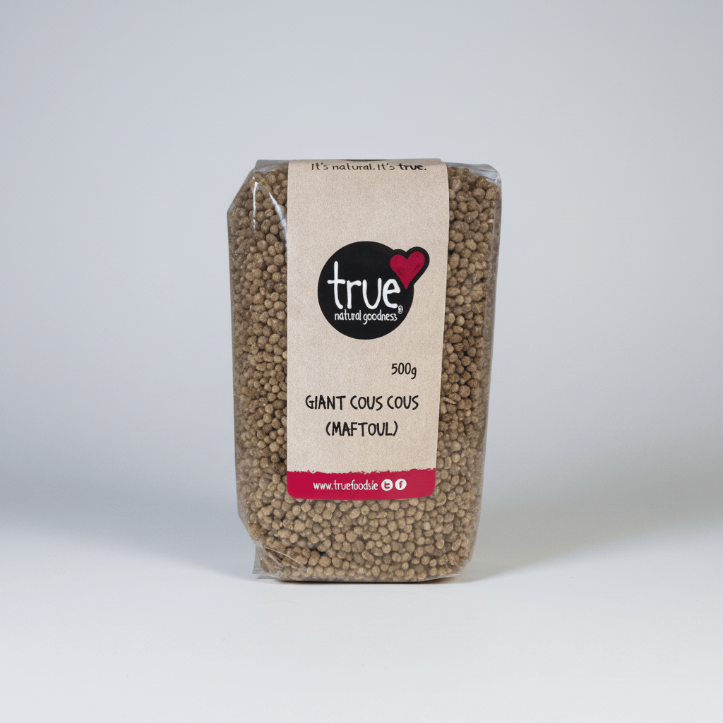 A 500g bag of True Natural Goods Giant Cous Cous (Maftoul) dog food, showing the brown kibble inside a clear bag with a kraft paper label.